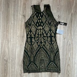 Green with gold glitter dress. Sleeveless. Perfect for a winter wedding guest!